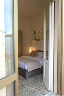 Letto o letti in una camera di Homelink Firenze - Charlotte