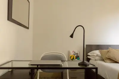 Letto o letti in una camera di Homelink Firenze - Charlotte