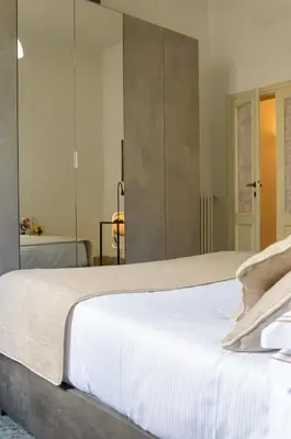Letto o letti in una camera di Homelink Firenze - Charlotte