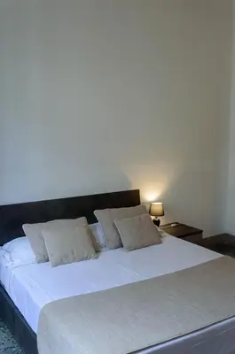 Letto o letti in una camera di Homelink Firenze - Charlotte