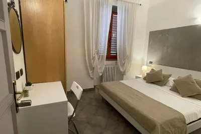 Letto o letti in una camera di Homelink Firenze - The Key