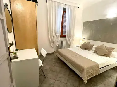 Letto o letti in una camera di Homelink Firenze - The Key