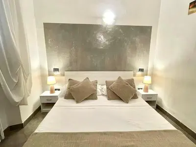 Letto o letti in una camera di Homelink Firenze - The Key