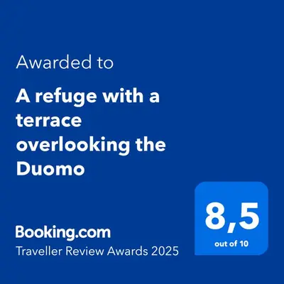Certificato, attestato, insegna o altro documento esposto da A refuge with a terrace overlooking the Duomo