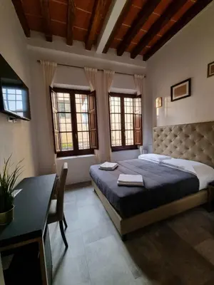 Letto o letti in una camera di B&B The Lux