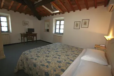 Letto o letti in una camera di Hotel Calzaiolo