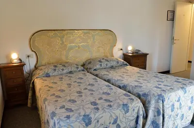Letto o letti in una camera di Hotel Calzaiolo