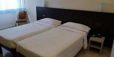 Letto o letti in una camera di AUTO PARK Hotel