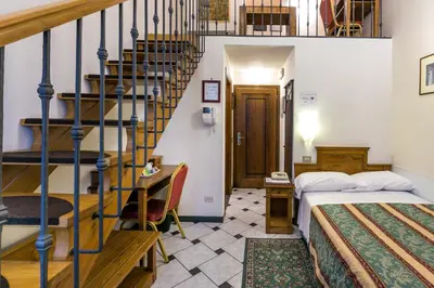 Letto o letti in una camera di Hotel Collodi Firenze