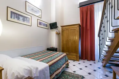 Letto o letti in una camera di Hotel Collodi Firenze