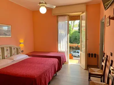 Letto o letti in una camera di Albergo Cinzia