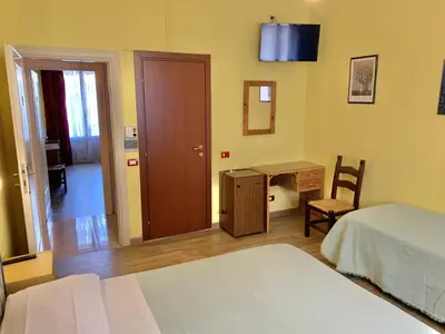 Letto o letti in una camera di Albergo Cinzia