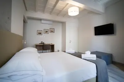 Letto o letti in una camera di Coco Places Rooms Santa Maria Novella, Centro Storico
