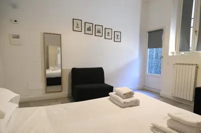 Letto o letti in una camera di Coco Places Rooms Santa Maria Novella, Centro Storico
