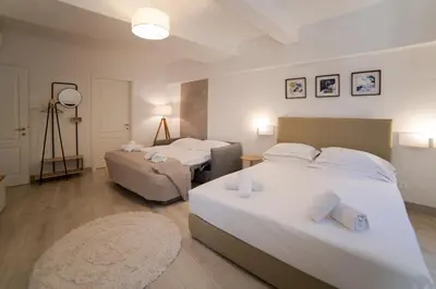Letto o letti in una camera di Coco Places Rooms Santa Maria Novella, Centro Storico