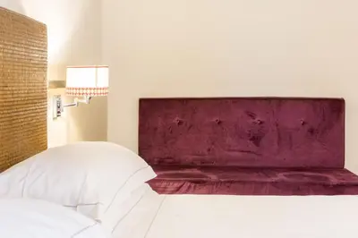 Letto o letti in una camera di Grand Hotel Cavour