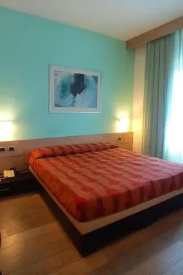 Letto o letti in una camera di Hotel I Cedri