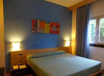 Letto o letti in una camera di Hotel I Cedri