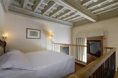Letto o letti in una camera di Hotel degli Orafi