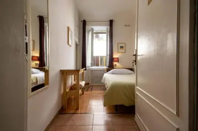 Letto o letti in una camera di Althea Rooms