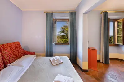 Letto o letti in una camera di Villa Castiglione