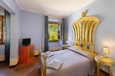 Letto o letti in una camera di Villa Castiglione