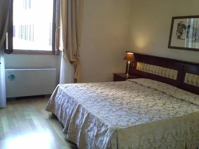 Letto o letti in una camera di Hotel Bigallo