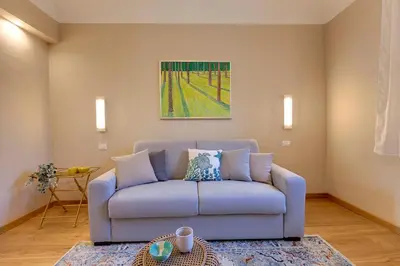 Area soggiorno di Woodie Apartment by Mamo Florence