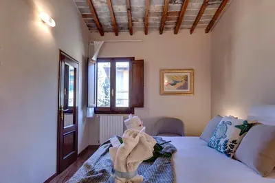 Letto o letti in una camera di Woodie Apartment by Mamo Florence