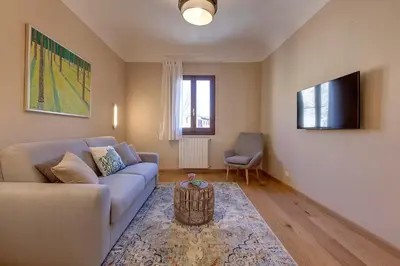 TV o dispositivi per l'intrattenimento presso Woodie Apartment by Mamo Florence