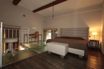 Letto o letti in una camera di Residence La Repubblica