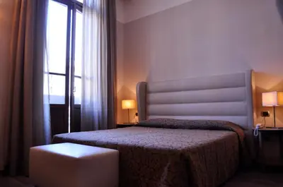 Letto o letti in una camera di Residence La Repubblica