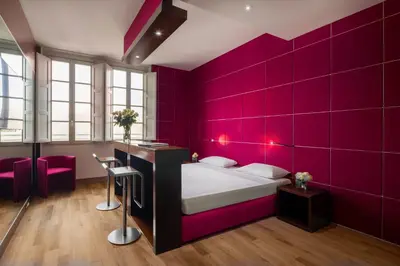 Letto o letti in una camera di UNA Hotels Vittoria Firenze