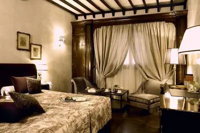 Letto o letti in una camera di Grand Hotel Baglioni