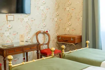 Letto o letti in una camera di Hotel Pendini