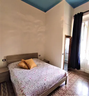 Letto o letti in una camera di APPARTAMENTO LUNA ROSSA