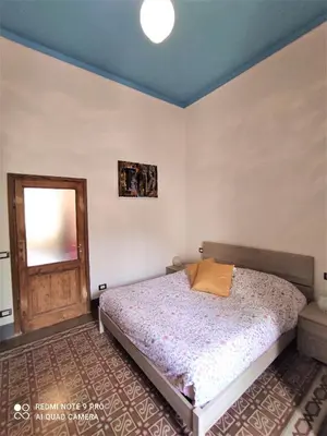 Letto o letti in una camera di APPARTAMENTO LUNA ROSSA