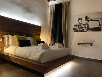 Letto o letti in una camera di Oro Nero Florence