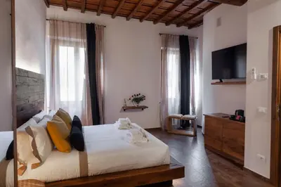 Letto o letti in una camera di Oro Nero Florence