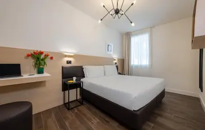 Letto o letti in una camera di Globus Urban Hotel