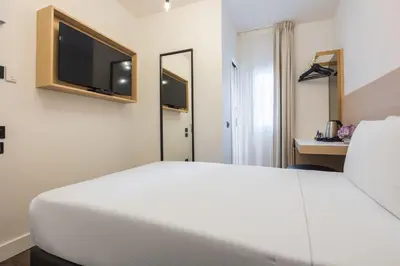Letto o letti in una camera di Globus Urban Hotel