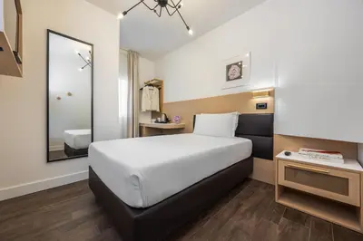 Letto o letti in una camera di Globus Urban Hotel