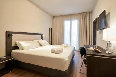 Letto o letti in una camera di Hotel Leonardo da Vinci