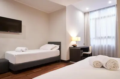 Letto o letti in una camera di Hotel Leonardo da Vinci