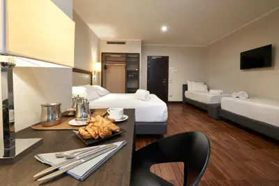 Letto o letti in una camera di Hotel Leonardo da Vinci