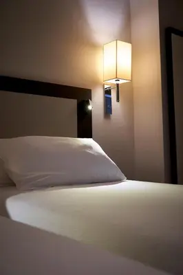 Letto o letti in una camera di Hotel Leonardo da Vinci