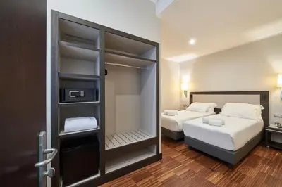 Letto o letti in una camera di Hotel Leonardo da Vinci