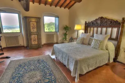 Letto o letti in una camera di Villa Selva
