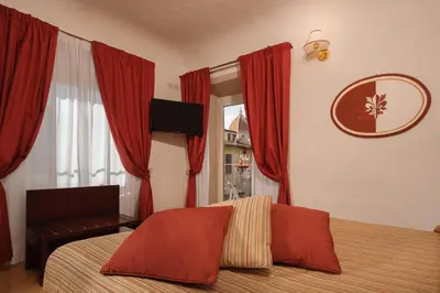 Letto o letti in una camera di Hotel Cardinal of Florence - recommended for ages 25 to 55