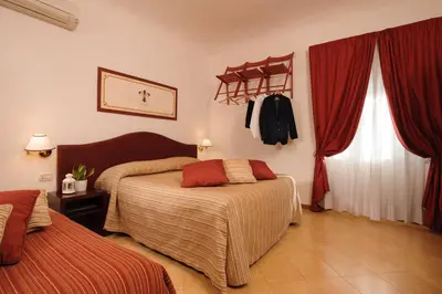 Letto o letti in una camera di Hotel Cardinal of Florence - recommended for ages 25 to 55
